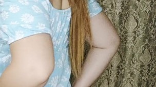 a redheaded hottie in an arousing blue dress.